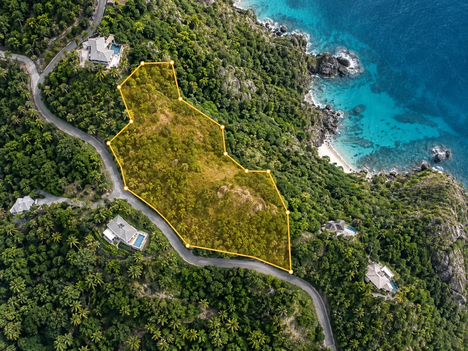 Conceptual aerial view of a coastal hillside with a site boundary drawn around the parcel